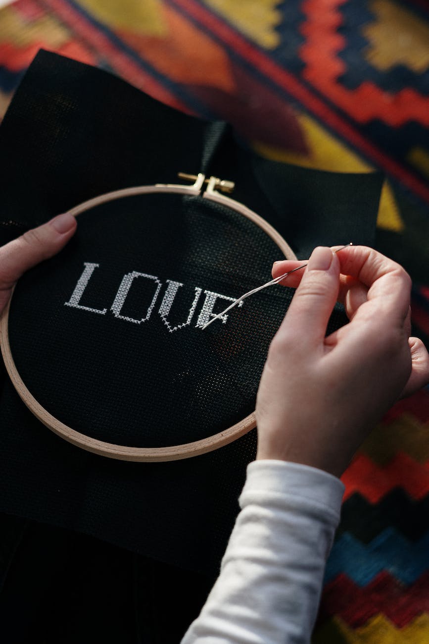person embroidering